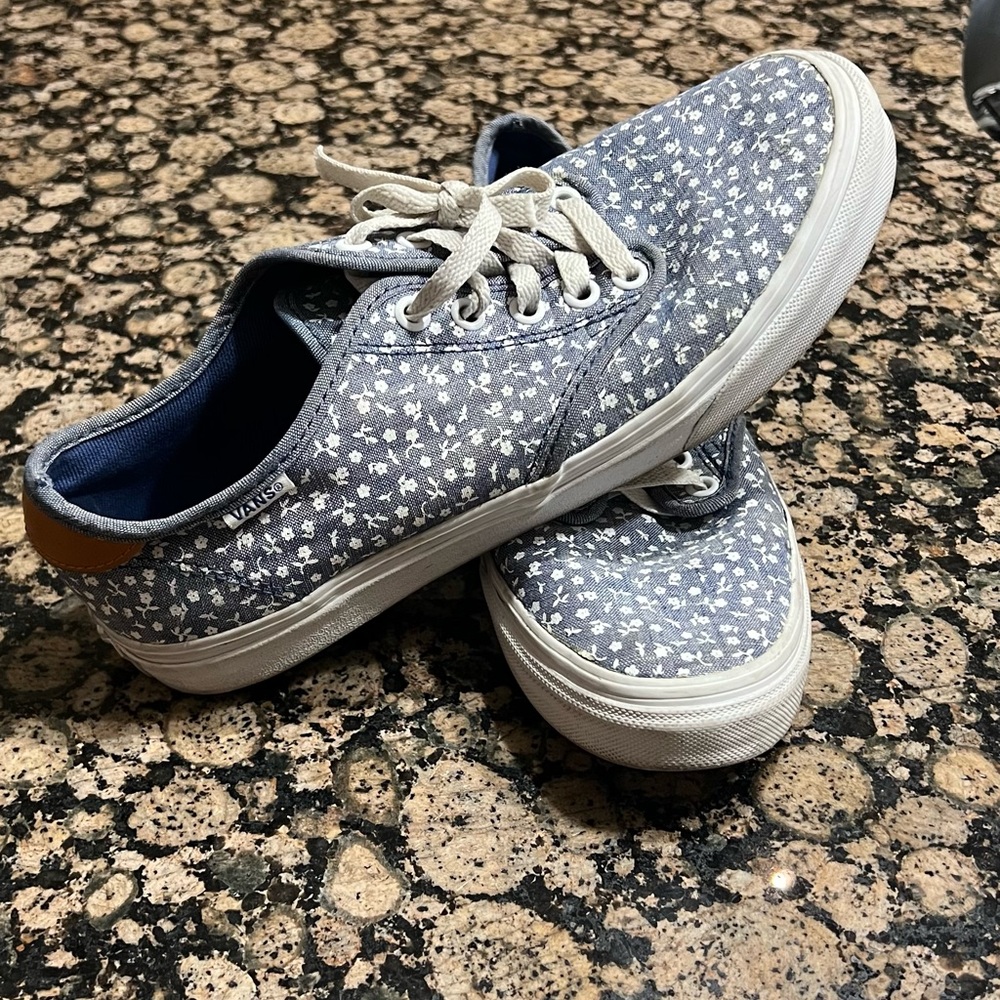 Blue and white vans with small white flowers. Size 8 1/2 in women’s.